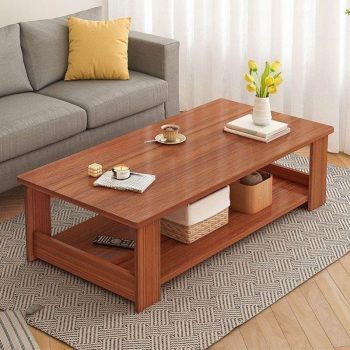 A wooden rectangular coffee table in a home office setting, featuring a smooth surface and sturdy design.