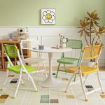 Modern round white dining table with a sleek design, perfect for contemporary dining rooms and stylish home interiors.