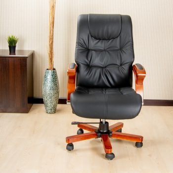 A high back directors reclining seat with padded cushions and ergonomic design, offering comfort and support for long hours of sitting.