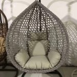 A sweet and cozy outdoor swing hammock, providing a comfortable and relaxing space for lounging in the garden or on the patio.