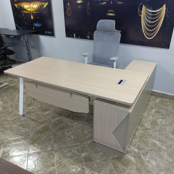 A high-end office desk featuring built-in storage, offering a spacious work surface and sleek design for an organized, professional workspace.