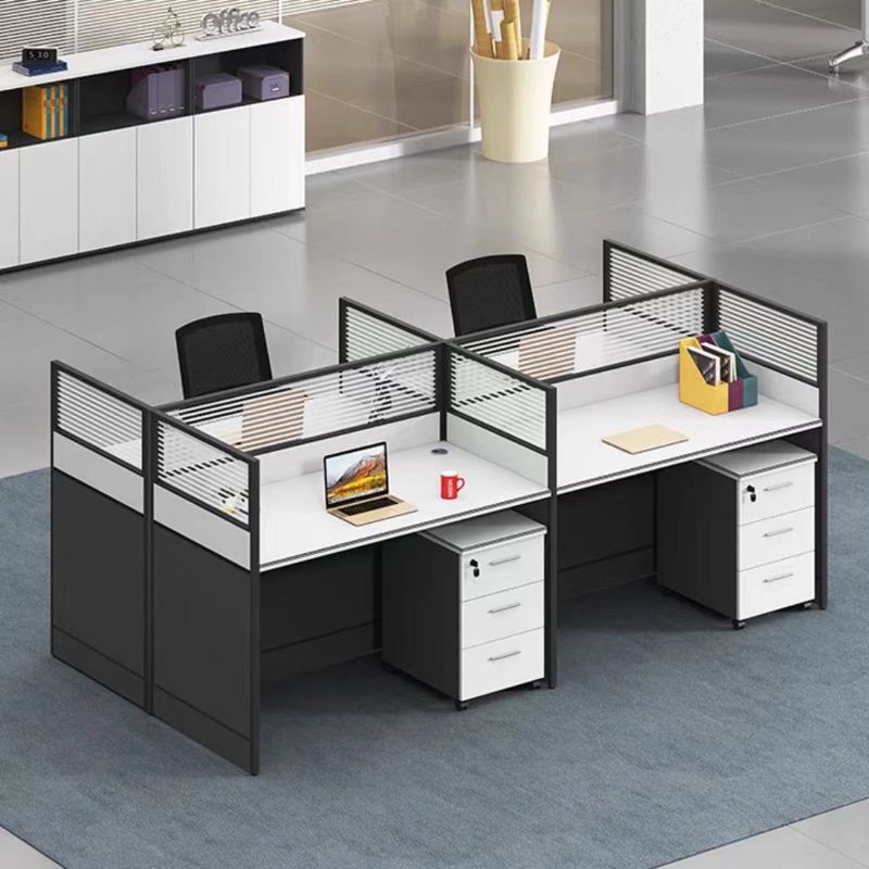 Four User Modern Office Workstation A modern office workstation setup featuring four desks, each equipped with a computer, ergonomic chair, and storage. The space is bright, minimalistic, and designed for productivity.
