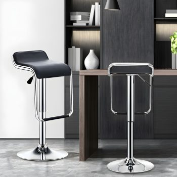 A faux leather adjustable height swivel barstool with a modern design, offering comfortable seating and smooth swivel functionality for any bar or counter.