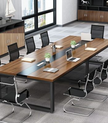 Modern management office meeting table with comfortable chairs around it, set up for a professional discussion or brainstorming session.