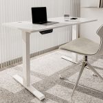 A modern height adjustable standing desk with a sleek design, offering an ergonomic solution for sitting and standing work positions.