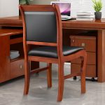 A wooden visitor’s office chair with a comfortable padded seat, sturdy wooden frame, and armrests, offering a stylish seating option for office guests.