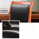 A wooden visitor’s office chair with a comfortable padded seat, sturdy wooden frame, and armrests, offering a stylish seating option for office guests.