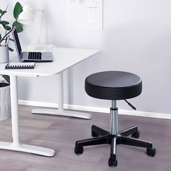 A sleek, armless leather bar stool with a comfortable cushioned seat and a sturdy metal base, perfect for modern interiors.