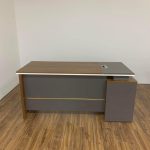 A sleek 1400mm corporate executive desk in wood finish, featuring a spacious work surface and organized storage options.