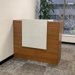 A sleek 1.2-meter office reception desk featuring a modern design with a spacious work surface and built-in storage for a professional look.