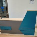 A 2.4-meter reception desk with modern design, offering ample space for office tasks and customer interaction.