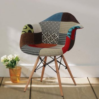 A comfortable arm rest patchwork chair featuring a mix of vibrant fabric patterns and sturdy armrests, ideal for casual seating.