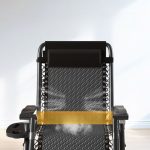 A fold-away recliner armchair with a comfortable headrest, featuring a modern design for easy storage and relaxation in any space.