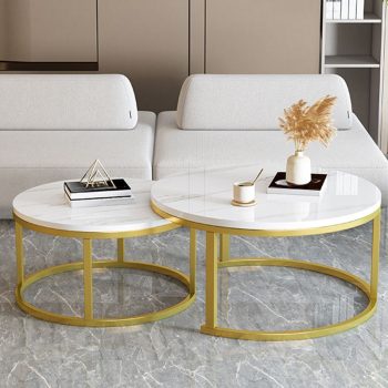 A set of nested circular coffee tables with a modern design, featuring sleek, round tops and minimalist frames for versatile living room décor.