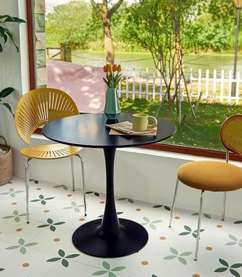 Modern Round Dining Table with sleek design and smooth surface, offering a stylish and functional space for meals and gatherings.
