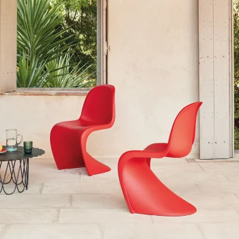 A stylish Vitra Panton Eames Chair, featuring a sleek, modern design with a comfortable molded seat and elegant curves.