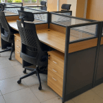 office workstation, office workstation desk, office workstation furniture, modular workstation, L-shaped workstation, U-shaped workstation, ergonomic workstation, small office workstation, modern office workstation, executive office workstation, dual workstation, shared workstation, team workstation, compact workstation, space-saving workstation, height adjustable workstation, sit-stand workstation, standing workstation, collaborative workstation, corner workstation, workstation with storage, workstation with drawers, workstation with shelves, workstation with cabinet, workstation with filing cabinet, workstation with hutch, workstation with privacy panel, workstation with partitions, minimalist workstation, stylish workstation, contemporary workstation, traditional office desk, wooden workstation, metal workstation, steel frame workstation, glass top workstation, laminate workstation, MDF workstation, eco-friendly workstation, sustainable workstation, heavy-duty workstation, durable workstation, foldable workstation, mobile workstation, portable workstation, modular office workstation, open plan workstation, cubicle workstation, call center workstation, receptionist workstation, home office workstation, commercial office workstation, custom workstation, designer workstation, luxury workstation, premium office desk, affordable workstation, budget workstation, workstation for small spaces, workstation for startups, coworking workstation, freelancer desk, workstation for developers, workstation for architects, workstation for designers, workstation for teachers, workstation for managers, workstation for executives, dual monitor workstation, triple monitor workstation, workstation with monitor stand, workstation with keyboard tray, workstation with CPU holder, workstation with cable management, wired workstation desk, tech-ready workstation, smart office desk, adjustable desk, motorized desk, electric height adjustable desk, crank height desk, workstation with LED lights, workstation with power outlets, workstation with USB ports, minimalist office setup, Scandinavian office desk, industrial office workstation, rustic workstation, white office workstation, black office workstation, grey workstation, oak finish workstation, walnut finish workstation, cherry wood workstation, beech wood workstation, corner office desk, floating workstation, wall-mounted workstation, executive suite workstation, office workstation table, reception area workstation, lobby workstation, employee workstation, workstation cubicle, desk partition system, four-person workstation, six-person workstation, eight-person workstation, cluster workstation, benching workstation, panel-based workstation, linear workstation, radial workstation, cluster workstation, office workstation systems, modular desk system, workstation design ideas, modern workstation layout, ergonomic furniture, adjustable work desk, standing work desk, sit stand workstation, electric desk, height adjustable table, compact work desk, office desk with shelf, workstation with file drawer, workstation with printer shelf, workstation for productivity, office furniture set, workstation set, workstation combo, workstation with ergonomic chair, workstation with accessories, workstation packages, workplace desk, corporate desk, office workstation setup, professional workstation, tech office desk, workstation trends, modern office layout, office interiors, workstation for remote work, remote office desk, home-based workstation, folding workstation, minimalist desk, clutter-free workstation, workstation with overhead shelf, cubicle desk, workstation for small teams, business workstation, startup furniture, tech startup desk, workstation for open office, open office benching, low partition workstation, desk with return, L-shaped desk, desk with side table, workstation with modesty panel, workstation with privacy screen, workstation with magnetic board, workstation with corkboard, workstation with whiteboard, office workstation layout, custom workstation design, sleek office furniture, contemporary office setup, office workstation manufacturer, office workstation supplier, imported workstation, local workstation supplier, Kenya office furniture, workstation Nairobi, workstation Kenya, workstation for schools, workstation for libraries, library workstation, hospital workstation, medical workstation, dental office workstation, salon workstation, workshop desk, industrial workstation table, metal work desk, engineer workstation, drafting workstation, CAD workstation, designer workstation desk, office table with drawers, desk with cupboard, desk with file storage, work table with drawers, adjustable worktable, standing workstation table, professional work desk, office desk options, workstation types, ergonomic desk ideas, height adjustable system, cable tray for workstation, desk grommets, under desk cable manager, workstation riser, desk converter, desktop riser, desk clamp monitor arm, workstation chair combo, office layout with workstations, workstation zoning, office pods, desk pods, breakout desk, quiet zone workstation, collaborative space furniture, open office desk solution, office furniture layout, office design for productivity, hybrid office workstation, multipurpose workstation, dual use workstation, shared workspace furniture, workspace optimization, task desk, executive table, reception desk setup, office desk styles, business desk, modern workspace, IT workstation, computer desk, office table, desk system, professional office desk, office productivity furniture, business furniture, smart desk setup, workstation organizer, workstation configuration, desk with drawer system, cluster desk, creative workstation, media workstation, video editing workstation, streaming workstation desk, gaming-style workstation, workstation for tech team, software team desk, developer workstation setup, workstation for engineers, minimalist developer desk, standing developer workstation, coding workstation, workstation with RGB lighting, workstation with smart features, IoT office desk, digital office furniture, wireless charging desk, office desk innovations, compact office furniture, minimalist workspace, adjustable work desk, office desks for sale, workstation online, office furniture shop, best office desk, trending workstations, workstation prices, workstation sizes, custom workstation furniture, made-to-order workstation, workstation distributor, workstation wholesaler, office desk wholesaler, bulk workstation supplier, workstation showroom, buy office workstation, workstation shopping, workstation offers, workstation clearance, workstation deals, workstation packages online,office workstation in Nairobi, office workstation in Mombasa, office workstation in Kisumu, office workstation in Nakuru, office workstation in Eldoret, office workstation in Thika, office workstation in Ruiru, office workstation in Kiambu, office workstation in Machakos, office workstation in Kakamega, office workstation in Bungoma, office workstation in Kisii, office workstation in Meru, office workstation in Embu, office workstation in Kitale, office workstation in Nyeri, office workstation in Kericho, office workstation in Naivasha, office workstation in Nanyuki, office workstation in Malindi, office workstation in Lamu, office workstation in Isiolo, office workstation in Garissa, office workstation in Voi, office workstation in Narok, office workstation in Bomet, office workstation in Homabay, office workstation in Migori, office workstation in Siaya, office workstation in Busia, office workstation in Vihiga, office workstation in Lodwar, office workstation in Maralal, office workstation in Kapenguria, office workstation in Chuka, office workstation in Wote, office workstation in Taveta, office workstation in Kilifi, office workstation in Kwale, office workstation in Taita, office workstation in Mandera, office workstation in Wajir, office workstation in Marsabit, office workstation in Moyale, office workstation in Tana River, office workstation in Hola, office workstation in Baringo, office workstation in Kabarnet, office workstation in Laikipia, office workstation in Nyahururu, office workstation in Limuru, office workstation in Githunguri, office workstation in Kangundo, office workstation in Tala, office workstation in Mwingi, office workstation in Makueni, office workstation in Kajiado, office workstation in Ngong, office workstation in Ongata Rongai, office workstation in Kitengela, office workstation in Syokimau, office workstation in Mlolongo, office workstation in Athi River, office workstation in Donholm, office workstation in Komarock, office workstation in Umoja, office workstation in Karen, office workstation in Lang’ata, office workstation in South B, office workstation in South C, office workstation in Parklands, office workstation in Westlands, office workstation in Kahawa, office workstation in Kasarani, office workstation in Roysambu, office workstation in Ruaka, office workstation in Gikambura, office workstation in Kikuyu, office workstation in Rongai, office workstation in Juja, office workstation in Githurai, office workstation in Zimmerman, office workstation in Runda, office workstation in Thindigua, office workstation in Nyari, office workstation in Gigiri, office workstation in Lavington, office workstation in Kileleshwa, office workstation in Kilimani, office workstation in Hurlingham, office workstation in Upperhill, office workstation in CBD Nairobi, office workstation in Industrial Area, office workstation in Pangani, office workstation in Eastleigh, office workstation in Buruburu, office workstation in Kariobangi, office workstation in Dandora, office workstation in Kangemi, office workstation in Kawangware, office workstation in Dagoretti, office workstation in Gachie, office workstation in Muthaiga, office workstation in Kitisuru, office workstation in Spring Valley, office workstation in Ridgeways, office workstation in Garden Estate, office workstation in Utawala, office workstation in Ruai, office workstation in Kamulu, office workstation in Joska, office workstation in Kangundo Road, office workstation in Githurai 45, office workstation in Kasarani Mwiki, office workstation in Pipeline, office workstation in Embakasi, office workstation in Umoja 2, office workstation in Donholm Phase 5, office workstation in Greenspan, office workstation in Nyayo Estate, office workstation in Tassia, office workstation in Fedha, office workstation in Tena, office workstation in Savanna, office workstation in Kariobangi North, office workstation in Kariobangi South, office workstation in Umoja Innercore, office workstation in Umoja Outercore, office workstation in Buruburu Phase 1, office workstation in Buruburu Phase 5, office workstation in Shauri Moyo, office workstation in Jericho, office workstation in Kaloleni, office workstation in Makadara, office workstation in Hamza, office workstation in Bahati, office workstation in Ziwani, office workstation in Pangani, office workstation in Ngara, office workstation in Parkroad, office workstation in Landimawe, office workstation in Jogoo Road, office workstation in Riruta, office workstation in Kawangware 46, office workstation in Kibera, office workstation in Soweto, office workstation in Laini Saba, office workstation in Silanga, office workstation in Makina, office workstation in Kambi Muru, office workstation in Gatwekera, office workstation in Lindi, office workstation in Kisumu Ndogo, office workstation in Raila Village, office workstation in Deep Sea, office workstation in Korogocho, office workstation in Mathare, office workstation in Huruma, office workstation in Mlango Kubwa, office workstation in Kiamaiko, office workstation in Mwiki, office workstation in Mwihoko, office workstation in Kahawa Sukari, office workstation in Kahawa West, office workstation in Kamiti Road, office workstation in Mirema, office workstation in Roysambu Estate, office workstation in Zimmerman Estate, office workstation in Githurai Kimbo, office workstation in Clay City, office workstation in TRM area, office workstation in Garden City, office workstation in Balozi Estate, office workstation in Sunton, office workstation in Kasarani Hunters, office workstation in Seasons Estate, office workstation in Njiru, office workstation in Mihango, office workstation in Kamulu, office workstation in Joska, office workstation in Kenol, office workstation in Kabati, office workstation in Makuyu, office workstation in Sagana, office workstation in Karatina, office workstation in Kutus, office workstation in Kerugoya, office workstation in Baricho, office workstation in Kianyaga, office workstation in Wanguru, office workstation in Mwea, office workstation in Embu Town, office workstation in Runyenjes, office workstation in Siakago, office workstation in Gaturi, office workstation in Kangema, office workstation in Mathioya, office workstation in Kambiti, office workstation in Murang’a, office workstation in Maragua, office workstation in Kenol Town, office workstation in Kandara, office workstation in Kigumo, office workstation in Kamahuha, office workstation in Makuyu Town, office workstation in Githunguri, office workstation in Ruiru Bypass, office workstation in Tatu City, office workstation in Ruiru East, office workstation in Kamakis, office workstation in Membley, office workstation in Eastern Bypass