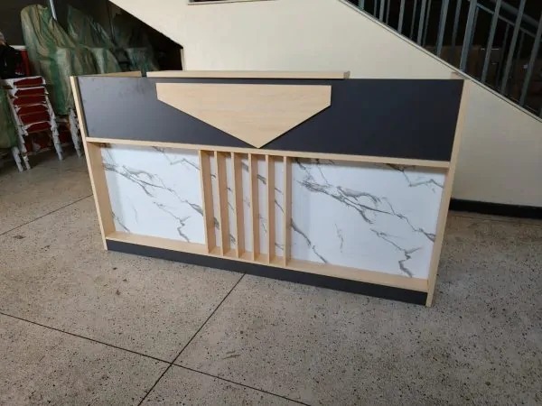 WhatsApp Image 2025-10-23 at 13.48.41 reception desk, modern reception desk, minimalist reception desk, salon reception desk, spa reception desk, hotel reception desk, office reception desk, front desk counter, reception counter, curved reception desk, L-shaped reception desk, U-shaped reception desk, luxury reception desk, wooden reception desk, white reception desk, black reception desk, marble reception desk, glass reception desk, custom reception desk, small reception desk, compact reception desk, large reception desk, contemporary reception desk, stylish reception desk, floating reception desk, modular reception desk, adjustable reception desk, ergonomic reception desk, retail reception desk, clinic reception desk, medical reception desk, dental reception desk, corporate reception desk, business reception desk, receptionist desk, check-in desk, lobby desk, lobby reception desk, entryway reception desk, entrance desk, front office desk, reception furniture, reception workstation, office front counter, reception area furniture, commercial reception desk, professional reception desk, durable reception desk, high-end reception desk, affordable reception desk, budget reception desk, boutique reception desk, premium reception desk, hospitality reception desk, beauty salon reception desk, barber shop reception desk, nail salon reception desk, spa front desk, waiting room reception desk, reception desk with storage, reception desk with drawers, reception desk with shelves, reception desk with lights, LED reception desk, illuminated reception desk, branded reception desk, customizable reception desk, reception desk design, designer reception desk, reception desk for small spaces, reception desk for office, reception desk for clinic, reception desk for hotel, industrial reception desk, rustic reception desk, farmhouse reception desk, Scandinavian reception desk, mid-century reception desk, vintage reception desk, classic reception desk, traditional reception desk, contemporary front desk, modern front counter, curved front counter, wooden front counter, luxury front counter, boutique front desk, elegant reception counter, compact front desk, narrow reception desk, space-saving reception desk, portable reception desk, foldable reception desk, standing reception desk, seated reception desk, height-adjustable reception desk, eco-friendly reception desk, sustainable reception desk, bamboo reception desk, steel reception desk, metal reception desk, acrylic reception desk, stone reception desk, quartz reception desk, granite reception desk, engineered wood reception desk, laminate reception desk, veneer reception desk, reception desk for coworking spaces, coworking reception desk, coworking front counter, reception desk for events, event reception desk, trade show reception desk, exhibition reception desk, pop-up reception desk, mall reception desk, showroom reception desk, gallery reception desk, museum reception desk, educational reception desk, school reception desk, university reception desk, student office desk, administration desk, medical front desk, healthcare reception counter, veterinary reception desk, optometry reception desk, chiropractic reception desk, law office reception desk, legal office front desk, consulting office reception desk, real estate office reception desk, property management reception desk, insurance office reception desk, bank reception desk, financial office reception desk, staffing office reception desk, HR reception desk, recruitment reception desk, coworking lobby desk, receptionist counter, visitor reception desk, customer service desk, client check-in desk, appointment desk, high-traffic reception desk, heavy-duty reception desk, commercial-grade reception desk, office foyer desk, entrance foyer desk, reception nook desk, small lobby desk, minimalist front counter, sleek reception desk, glossy reception desk, matte reception desk, textured reception desk, patterned reception desk, LED-lit counter, reception desk with signage, branded counter, corporate lobby desk, luxury lobby desk, executive reception desk, high-gloss reception desk, two-tier reception desk, multi-level reception desk, double reception desk, dual-station reception desk, single-station reception desk, open-space reception desk, closed-front reception desk, slat wall reception desk, panelled reception desk, geometric reception desk, artistic reception desk, bespoke reception desk, handcrafted reception desk, custom-made reception desk, modular counter, interchangeable panel desk, reception desk kit, reception desk bundle, affordable office counter, economy reception desk, high-style reception desk, professional lobby counter, business lobby desk, commercial front desk, reception center desk, reception podium, front office podium, welcome desk, welcome station, greeting desk, customer welcome counter, welcome center desk, registration desk, sign-in desk, hotel front desk, concierge desk, guest services desk, hospitality desk, boutique hotel desk, resort reception desk, spa concierge desk, wellness center reception desk, fitness center reception desk, gym reception desk, yoga studio reception desk, pilates studio reception desk, dance studio reception desk, tattoo shop reception desk, piercing studio reception desk, aesthetic clinic reception desk, medspa reception desk, cosmetic clinic reception desk, orthodontic reception desk, pediatric office reception desk, senior care reception desk, care home reception desk, community center reception desk, nonprofit office reception desk, government office reception desk, city hall reception desk, public building reception desk, airport reception desk, terminal reception desk, transportation hub reception desk, coworking hub desk, innovation center reception desk, tech office reception desk, startup office reception desk, IT company reception desk, digital agency reception desk, marketing agency reception desk, advertising agency reception desk, PR office reception desk, architecture firm reception desk, design studio reception desk, interior design office reception desk, engineering office reception desk, construction office reception desk, showroom front desk, retail counter, customer service counter, sales counter, boutique counter, fashion store reception desk, clothing store counter, jewelry store counter, watch store counter, electronics store reception desk, phone store reception desk, gadget store counter, luxury retail desk, home décor store counter, furniture showroom desk, art gallery front desk, museum front counter, exhibition hall reception desk, event venue reception desk, conference center reception desk, hotel lobby counter, apartment building reception desk, condo reception desk, residential lobby desk, security desk, guard desk, doorman desk, access control desk, reception desk with privacy panel, privacy-screen reception desk, frosted-glass reception desk, reception desk with cable management, wired reception desk, tech-friendly reception desk, USB-equipped reception desk, smart reception desk, reception desk with monitor stand, reception desk with keyboard tray, office reception counter with storage, drawer cabinet reception desk, reception desk with lockable storage, secure reception desk, anti-scratch reception desk, waterproof reception desk, stain-resistant reception desk, impact-resistant reception desk, easy-clean reception desk, low-maintenance reception desk, ergonomic front desk, reception desk with footrest, receptionist workstation, office greeting station, reception seating area desk, waiting room counter, hospitality counter, commercial foyer desk, business entrance desk, welcome area desk, professional front desk, office check-in counter, lobby check-in counter, stylish front desk, elegant front counter, modern office desk, contemporary lobby desk, professional workspace desk, reception hub desk, signature reception desk, iconic reception desk, standout reception desk, bold design reception desk, statement reception desk, artistic front counter, sculptural reception desk, curved modern desk, ultra-modern reception desk, futuristic reception desk, LED front desk, RGB reception desk, tech reception station, minimalist counter, neutral reception desk, two-tone reception desk, reception desk with accent lighting, reception counter with logo panel, branding-ready desk, corporate identity desk, professional grade front desk, office front entrance desk, creative studio reception desk, branding studio front desk, media office reception desk, newsroom reception desk, production studio reception desk, film studio reception desk, photography studio reception desk, coworking common area desk, open office lobby desk, reception desk with seating, reception bench combo, integrated reception desk, multifunction reception desk, hybrid reception counter, flexible reception desk, adjustable layout desk, reception peninsula desk, compact corner reception desk, corner front desk, narrow front counter, space-maximizing reception desk, efficiency-focused reception desk, lightweight reception desk, mobile reception desk, wheeled reception desk, portable check-in desk, collapsible reception counter, event front counter, pop-up store counter, marketing booth counter, tradeshow front desk, exhibition booth desk, museum info desk, gallery info counter, visitor center reception desk, welcome booth desk, community help desk, service desk, operations desk, entry desk, corporate front desk, admin reception desk, executive lobby desk, custom lobby counter, premium office desk, sleek office counter, hospitality front desk, modern check-in station, workstation reception desk, multi-user reception desk, expandable reception desk, redesigned reception desk, office makeover desk, lobby upgrade desk, showroom upgrade desk, premium wood reception desk, oak reception desk, walnut reception desk, maple reception desk, cherry wood reception desk, reclaimed wood reception desk, distressed wood reception desk, barn wood reception desk, eco-wood reception desk, painted reception desk, glossy white reception desk, matte black reception desk, charcoal reception desk, beige reception desk, tan reception desk, grey reception desk, navy reception desk, gold accent reception desk, brass detail reception desk, chrome accent reception desk, stainless steel reception desk, aluminum reception desk, industrial metal reception desk, heavy-duty metal desk, powder-coated reception desk, reception desk with glass top, frosted glass counter, tempered glass reception desk, acrylic front desk, plexiglass reception desk, resin reception desk, stone-look reception desk, faux-marble reception desk, faux-stone reception counter, natural stone reception desk, luxury marble counter, premium quartz reception desk, custom shape reception desk, circular reception desk, oval reception desk, S-shaped reception desk, wave reception desk, triangular reception desk, geometric front desk, polygon desk, asymmetric reception desk, symmetric reception desk, balanced design desk, reception desk with open shelves, reception desk with cubbies, reception desk with file drawers, reception desk with organizer, receptionist command station, front counter workstation, administrative reception desk, reception console, office console desk, commercial console desk, wooden counter desk, designer lobby desk, front office reception desk, administrative check-in station, clinic lobby desk, patient check-in desk, hospital reception desk, imaging center reception desk, pharmacy reception counter, lab reception desk, research center reception desk, biotechnology office reception desk, tech startup lobby desk, AI office reception desk, fintech office reception desk, crypto office reception desk, co-living reception desk, luxury apartment lobby desk, condominium lobby counter, property lobby desk, leasing office reception desk, real estate front counter, hotel concierge station, boutique concierge desk, luxury concierge counter, elegant hospitality desk, premium reception station, chic reception desk, classy reception counter, refined reception desk, upscale reception desk, posh reception desk, deluxe reception desk, sophisticated reception desk, polished reception counter, professional reception area desk, reception unit, reception desk assembly, reception desk package, office reception upgrade, lobby renovation desk, workspace reception furniture, office entrance counter, reception bar desk, tall reception desk, low reception desk, slim reception desk, reception display desk, front counter display, reception desk for branding, reception area statement piece, reception centerpiece, lobby centerpiece desk, corporate statement desk, leading-edge reception desk, high-function reception desk, multitier counter, office greeting counter, welcome counter, professional greeting desk, formal reception desk, informal reception desk, stylish work counter, reception table, business front table, lobby table desk, entry counter, entry reception desk, point of entry desk, first impression desk, entry statement desk, office décor desk, lobby décor desk, workplace front desk, organization desk, client-facing desk, visitor-facing desk, reception interface desk, office presentation desk, impactful reception desk, attention-grabbing reception desk, trend-forward reception desk, office center desk, central reception desk, receptionist center station, guest welcome desk, service center reception desk, support desk counter, on-brand reception desk, signature lobby piece, boutique office desk, branded office desk, office façade desk, open office front desk, reception planning desk, ergonomic lobby desk, comfort reception desk, healthy posture reception desk, anti-fatigue reception desk, pleasant reception counter, office hospitality desk, commercial greeting desk, retail front desk, small business reception desk, entrepreneur office desk, startup lobby counter, coworking welcome desk, multifunctional lobby desk, reception bench, front counter platform, client service front desk, upscale modern reception desk, fine finish reception desk, luxury materials reception desk, interior-fit reception desk, business furniture, commercial furniture, office furniture front desk, modern business counter, professional office fixture, workplace furniture desk, sleek commercial desk, contemporary commercial counter, crafted reception desk, made-to-order reception desk, flexible configuration desk, adaptable reception desk, hospitality lobby counter, retail check-in desk, store greeting counter, boutique welcome table, elegant greeting desk, iconic foyer desk, distinctive reception desk, bold foyer counter, flagship store reception desk, signature office reception counter, welcoming reception desk, inviting reception desk, customer-friendly desk, user-friendly reception desk, space-efficient reception station, optimized front desk, workplace lobby solution, commercial lobby solution, office check-point desk.