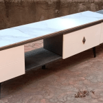 tv stand, tv console, tv cabinet, media console, media cabinet, entertainment center, entertainment unit, tv unit, television stand, flat screen tv stand, LED tv stand, smart tv stand, 4K tv stand, living room tv stand, modern tv stand, contemporary tv stand, minimalist tv stand, rustic tv stand, farmhouse tv stand, industrial tv stand, Scandinavian tv stand, boho tv stand, mid century tv stand, mid century modern tv stand, vintage tv stand, retro tv stand, classic tv stand, traditional tv stand, transitional tv stand, luxury tv stand, premium tv stand, high end tv stand, affordable tv stand, cheap tv stand, budget tv stand, large tv stand, small tv stand, compact tv stand, narrow tv stand, wide tv stand, long tv stand, tall tv stand, low profile tv stand, floating tv stand, wall mounted tv stand, floating media console, wall hung tv stand, corner tv stand, corner media console, tv stand with storage, tv stand with shelves, tv stand with drawers, tv stand with cabinets, tv stand with doors, tv stand with glass doors, tv stand with open shelves, tv stand with fireplace, electric fireplace tv stand, LED fireplace tv stand, modern fireplace tv stand, tv stand with lights, illuminated tv stand, RGB tv stand, gaming tv stand, gaming media console, wooden tv stand, solid wood tv stand, engineered wood tv stand, MDF tv stand, plywood tv stand, glass tv stand, tempered glass tv stand, steel tv stand, metal tv stand, iron tv stand, aluminum tv stand, bamboo tv stand, rattan tv stand, wicker tv stand, acrylic tv stand, mirror tv stand, mirrored tv console, marble top tv stand, stone top tv stand, faux marble tv stand, laminate tv stand, eco friendly tv stand, sustainable tv stand, reclaimed wood tv stand, recycled materials tv stand, rustic wood tv stand, distressed wood tv stand, farmhouse wood tv stand, industrial pipe tv stand, metal frame tv stand, heavy duty tv stand, sturdy tv stand, durable tv stand, strong tv stand, reinforced tv stand, high capacity tv stand, high weight capacity tv stand, tv stand for 55 inch tv, tv stand for 65 inch tv, tv stand for 75 inch tv, tv stand for 85 inch tv, universal tv stand, tv stand for big tvs, tv stand for flat screens, tv stand for curved tvs, adjustable tv stand, height adjustable tv stand, swivel tv stand, rotating tv stand, mobile tv stand, rolling tv stand, tv cart, tv trolley, tv stand with wheels, portable tv stand, multipurpose tv stand, media storage stand, dvd storage stand, blu ray storage stand, gaming console stand, ps5 tv stand, xbox stand, nintendo switch stand, cable management tv stand, wire management tv stand, hidden cable tv stand, clutter free tv stand, organizer tv stand, entertainment organizer, tv stand with baskets, tv stand with bins, cubby tv stand, modular tv stand, customizable tv stand, diy tv stand, adjustable shelving tv stand, multi shelf tv stand, dual shelf tv stand, three tier tv stand, four tier tv stand, open frame tv stand, closed back tv stand, slatted tv stand, mesh door tv stand, sliding door tv stand, barn door tv stand, modern barn door tv stand, shutter door tv stand, glass door media cabinet, decorative tv stand, stylish tv stand, aesthetic tv stand, luxury media console, designer tv stand, artisan tv stand, handcrafted tv stand, handmade media console, bespoke tv stand, custom tv stand, unique tv stand, limited edition tv stand, living room media unit, bedroom tv stand, office tv stand, den tv stand, family room tv stand, game room tv stand, home theater tv stand, theater console, multimedia stand, audio video stand, av stand, soundbar compatible tv stand, soundbar shelf tv stand, speaker friendly tv stand, home audio tv console, home entertainment rack, tv bench, media bench, tv table, media table, entertainment table, media shelf, tv shelf, entertainment shelf, tv entertainment furniture, home entertainment furniture, accent tv stand, feature tv stand, modern living room tv stand, contemporary living room tv stand, stylish media furniture, interior decor tv stand, home decor tv stand, trending tv stand, bestselling tv stand, popular tv stand, top rated tv stand, premium quality tv stand, high quality tv stand, value tv stand, family friendly tv stand, kid friendly tv stand, pet friendly tv stand, scratch resistant tv stand, stain resistant tv stand, spill resistant tv stand, easy clean tv stand, waterproof tv stand, moisture resistant tv stand, dust resistant tv stand, ventilation friendly tv stand, electronics safe tv stand, anti tip tv stand, stable tv stand, wobble free tv stand, safe tv stand, solid construction tv stand, reinforced frame tv stand, dual tone tv stand, two tone tv stand, black tv stand, white tv stand, brown tv stand, gray tv stand, walnut tv stand, oak tv stand, espresso tv stand, cherry tv stand, mahogany tv stand, natural wood tv stand, light wood tv stand, dark wood tv stand, rustic brown tv stand, driftwood tv stand, reclaimed finish tv stand, industrial black tv stand, matte black tv stand, glossy black tv stand, gold accent tv stand, brass accent tv stand, chrome tv stand, matte tv stand, textured finish tv stand, smooth finish tv stand, ribbed panel tv stand, fluted tv stand, slat style tv stand, geometric tv stand, patterned tv stand, bohemian tv stand, eclectic tv stand, Japandi tv stand, Zen tv stand, minimalist wooden tv stand, modern glass tv stand, floating shelf tv stand, tv wall shelf, entertainment wall system, modular media wall, home media wall unit, small space tv stand, apartment tv stand, condo tv stand, studio tv stand, tiny home tv stand, compact media console, narrow depth tv stand, small footprint tv stand, large living room tv stand, wide living room tv stand, oversized tv stand, heavy duty media console, robust tv stand, ultra durable tv stand, high performance tv stand, premium entertainment center, storage rich tv stand, multi compartment tv stand, dual cabinet tv stand, adjustable door tv stand, decorative cabinet tv stand, minimalist cabinet tv stand, farmhouse cabinet tv stand, rustic cabinet tv stand, industrial cabinet tv stand, modern cabinet tv stand, tv stand for renters, easy assemble tv stand, quick assemble tv stand, no tool assembly tv stand, flat pack tv stand, ready to assemble tv stand, home DIY tv stand, tv stand with instructions, optimized storage tv stand, organization friendly tv stand, clutter reducing tv stand, stylish storage tv console, cable tidy tv stand, power strip friendly tv stand, electronic friendly tv stand, tv stand for smart home, smart tv furniture, modern home entertainment furniture, curated tv stand, interior designer recommended tv stand, premium home furnishing tv stand, upscale tv stand, value media console, open concept tv stand, closed concept tv stand, multifunction tv stand, versatile tv stand, adaptive tv stand, room enhancing tv stand, stage tv stand, accent furniture, living room statement piece, centerpiece tv console, entertainment area furniture, home upgrade tv stand, room upgrade tv stand, decor friendly tv stand, trending home furniture, modern home tv console, storage optimized tv stand, high capacity media console, tv stand for renters, gift tv stand, tv stand for housewarming, best tv stand, top reviewed tv stand, stylish tv unit, elegant tv stand, sophisticated media console, and hundreds more related tv stand SEO keywords.